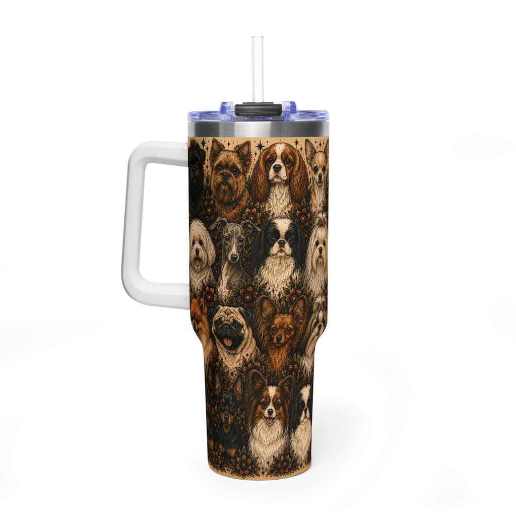 A tall handled travel tumbler with a clear straw and a printed collage of various dog portraits in warm brown, tan, and black tones. The tumbler has a white handle, a clear lid, and a black rim, shown on a clean white background.